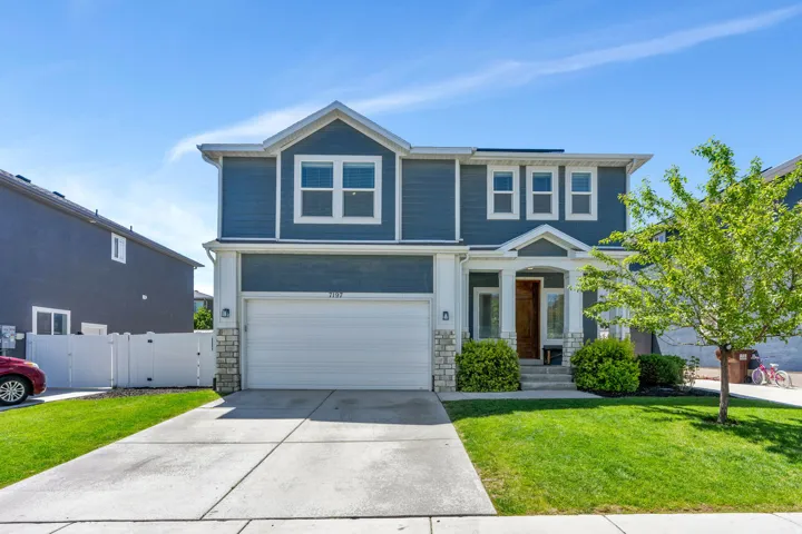 Two-story residence featuring blue siding and white trim