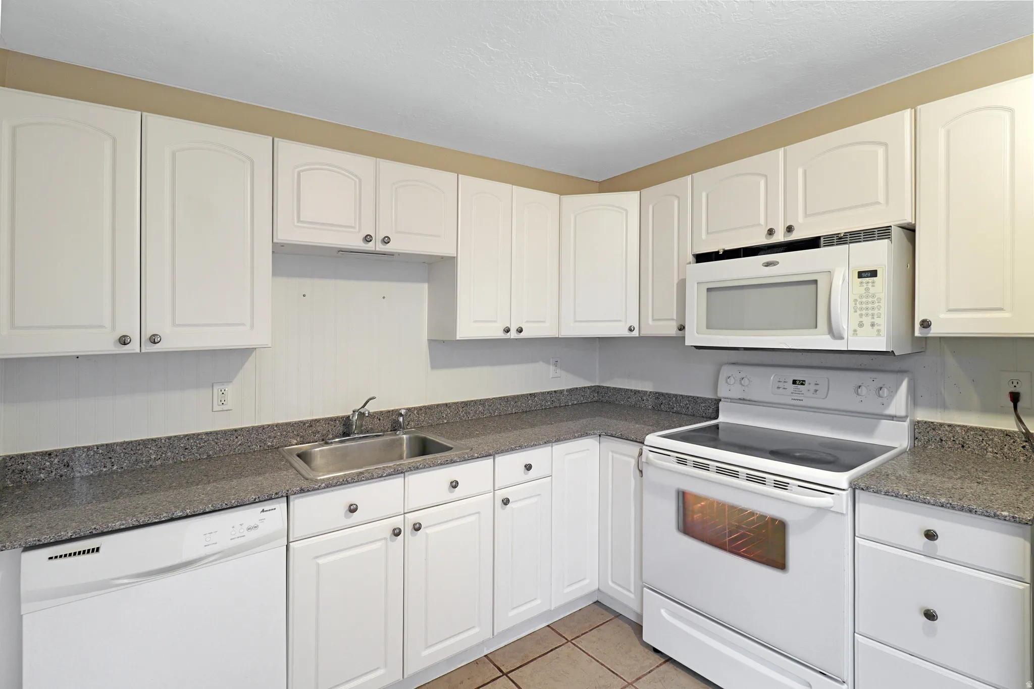 Nice Cabinetry, Granite Counters and Tile Flooring