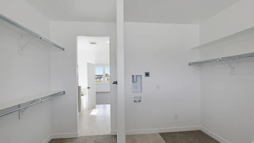 Laundry area with dedicated utility hookups