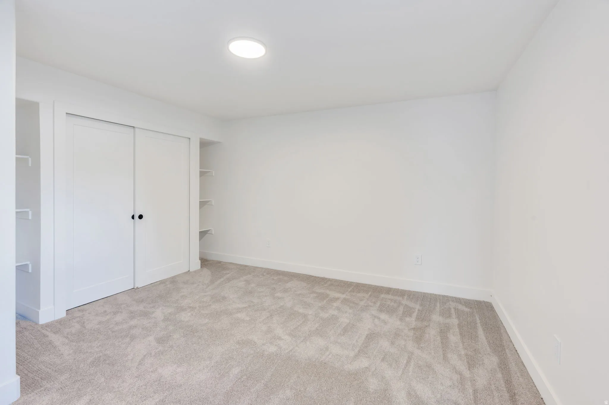 Neutral-toned carpeting paired with white walls