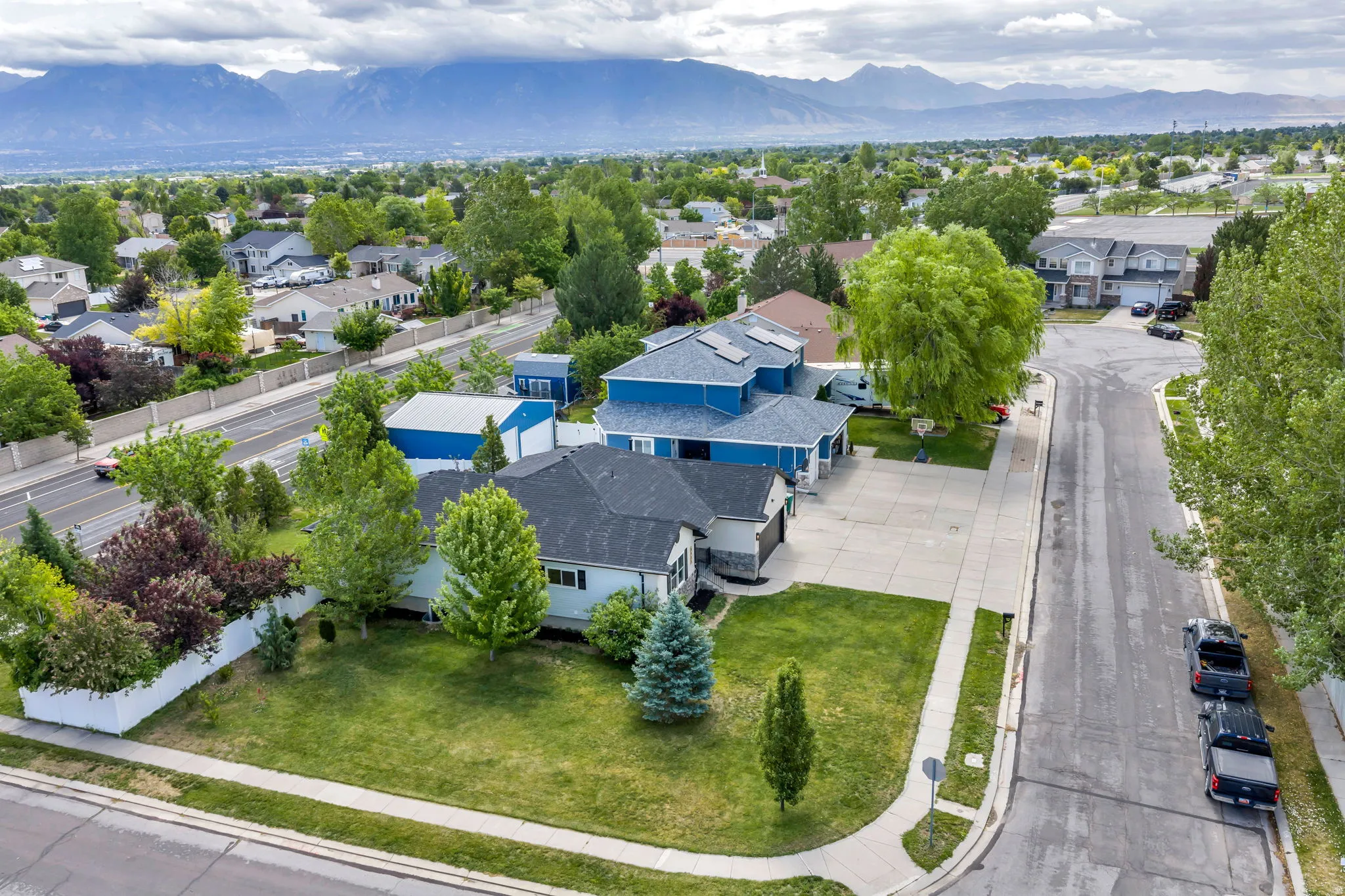 Aerial perspective showcasing a residential neighborhood with distant mountains