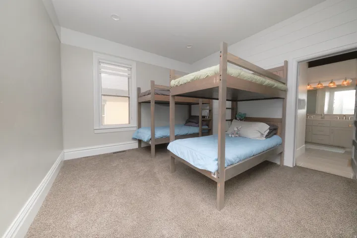 Carpeted room bedroom with recessed lighting