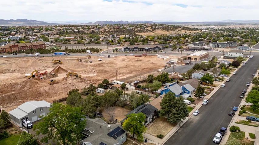 Expansive undeveloped land with visible construction activity
