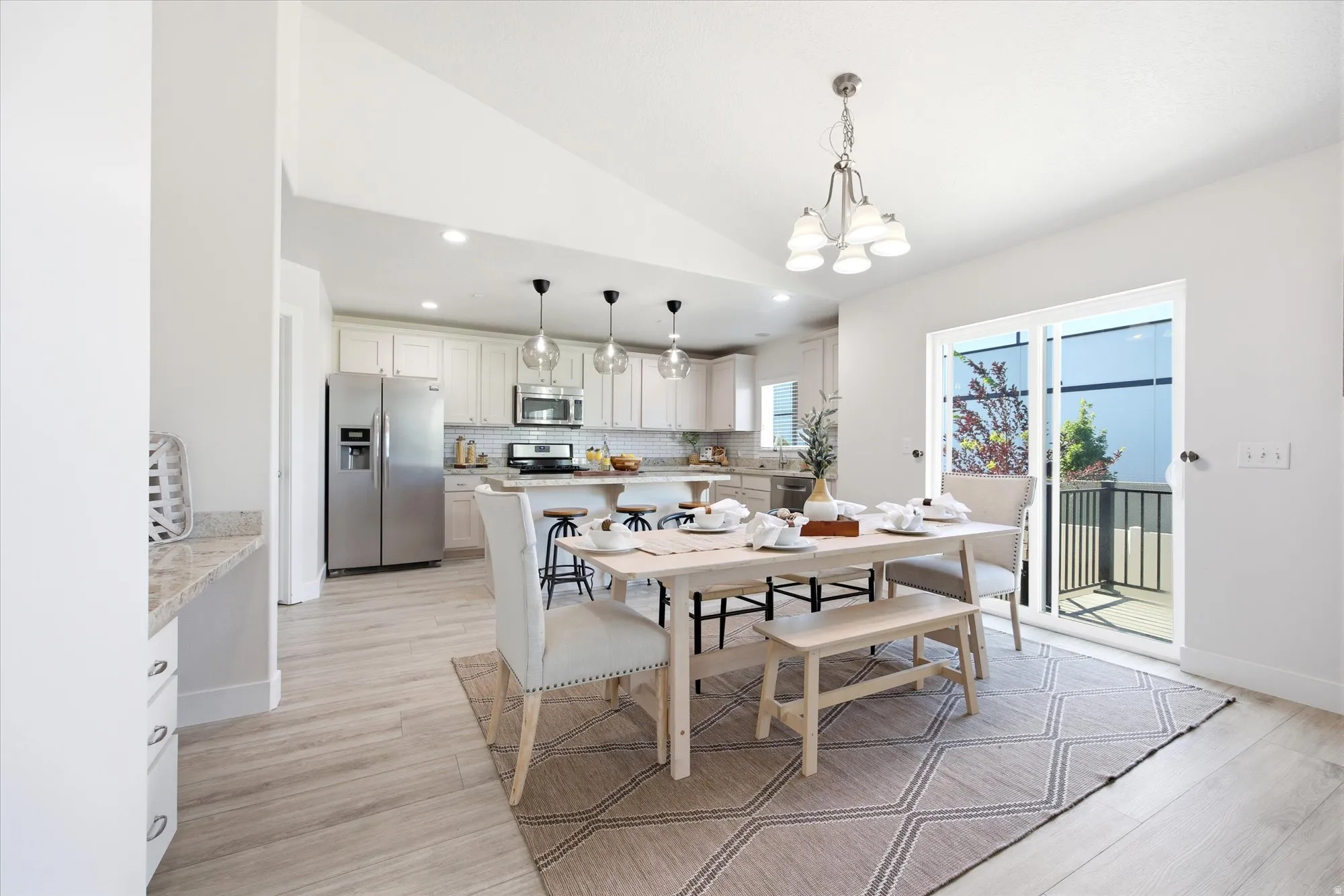 Bright dining area featuring a sliding glass door to an outdoor patio