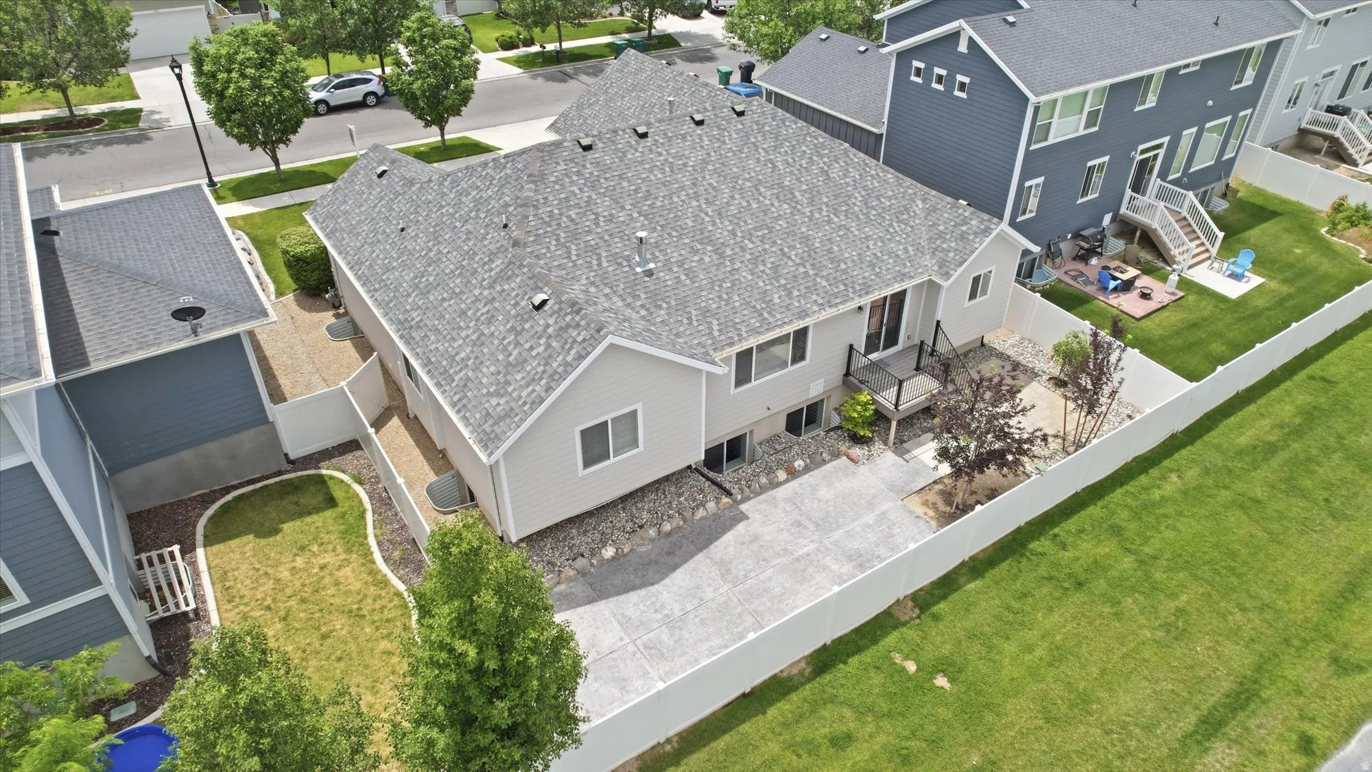 Aerial perspective showcasing the property with a light gray exterior siding