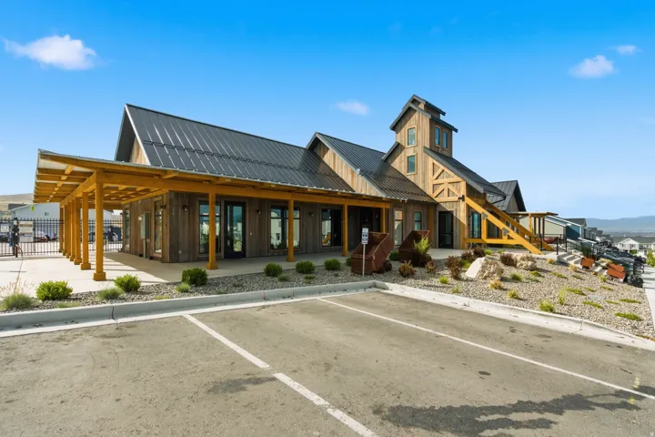 Wood-sided commercial building with a dark metal roof