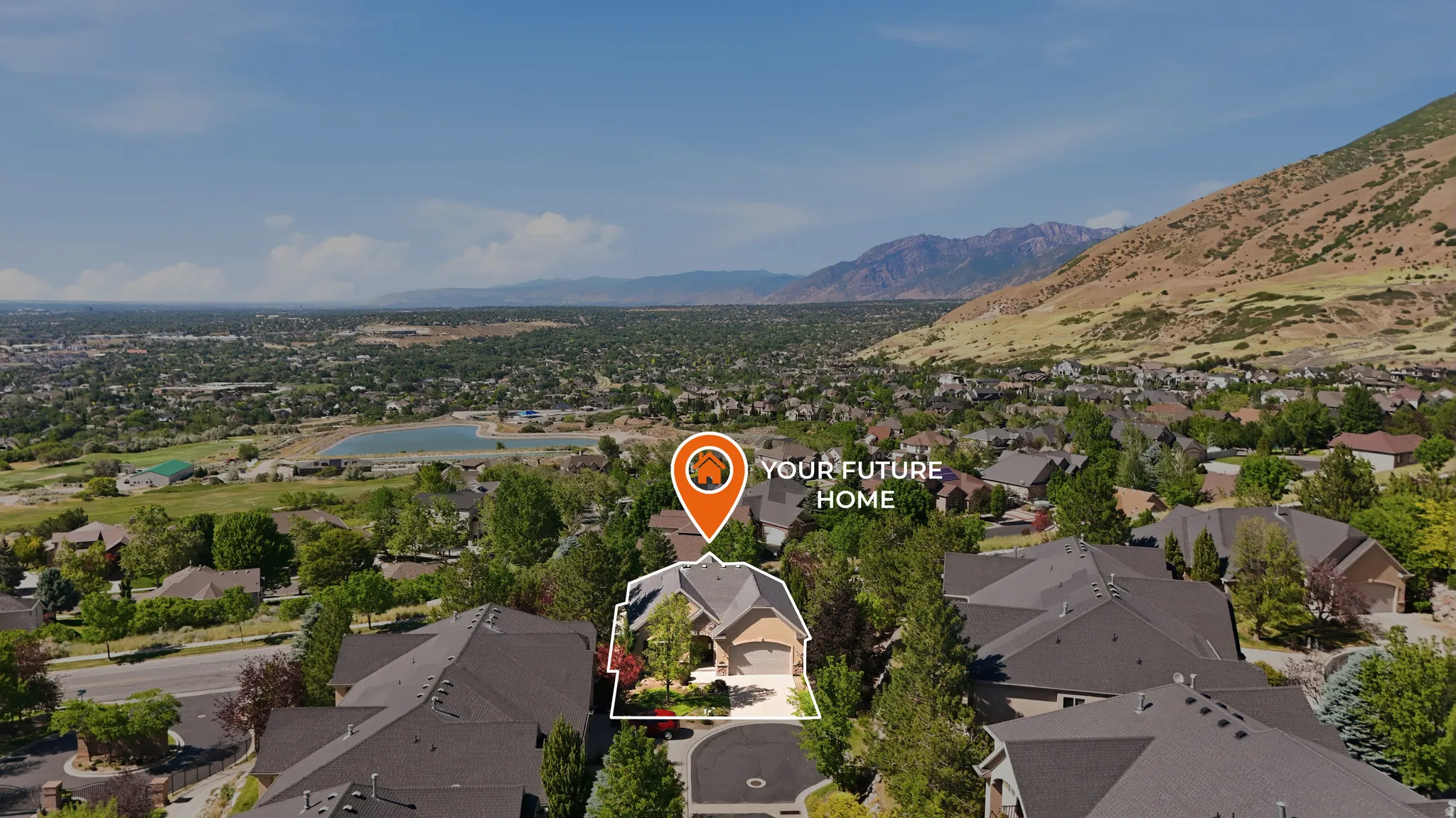 Aerial perspective of a residential area with a prominent mountain backdrop