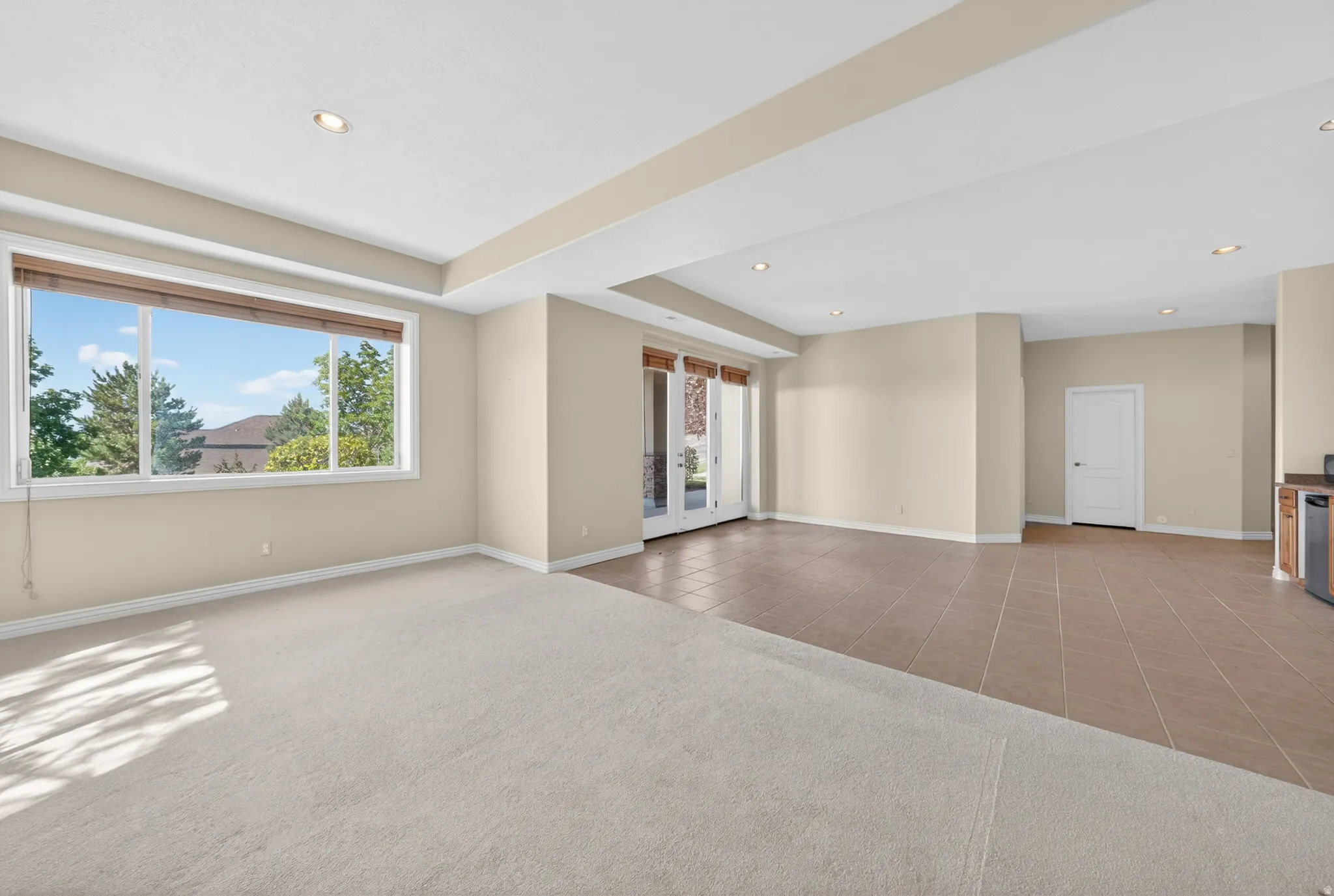 Spacious room featuring a large picture window