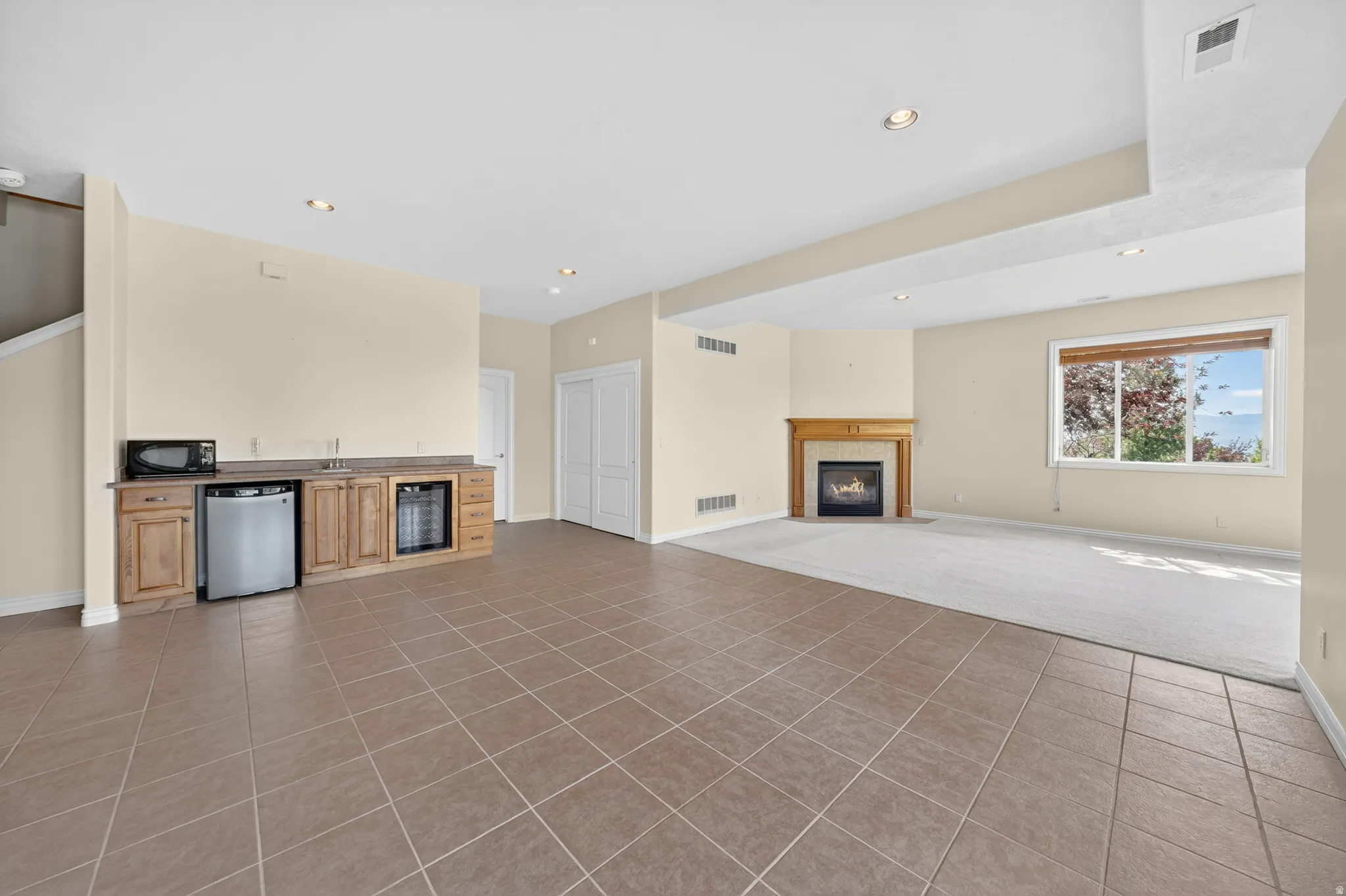 Basement family room and dining area with wet bar.