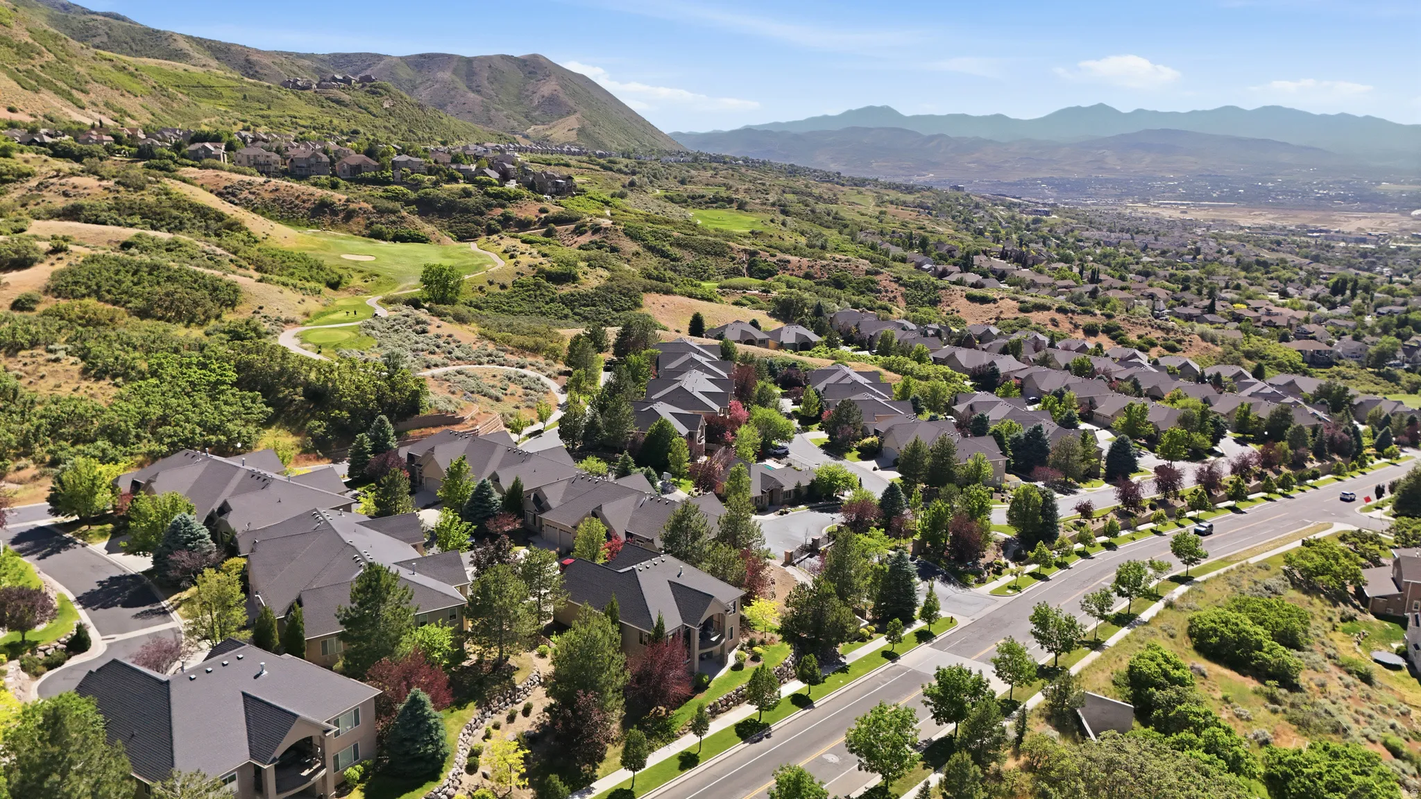 Residential community featuring mature landscaping, paved roads, and a  nearby golf course and hiking trails