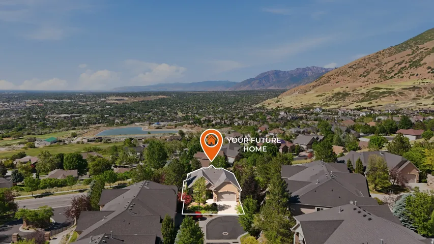 Aerial perspective of a residential area with a prominent mountain backdrop