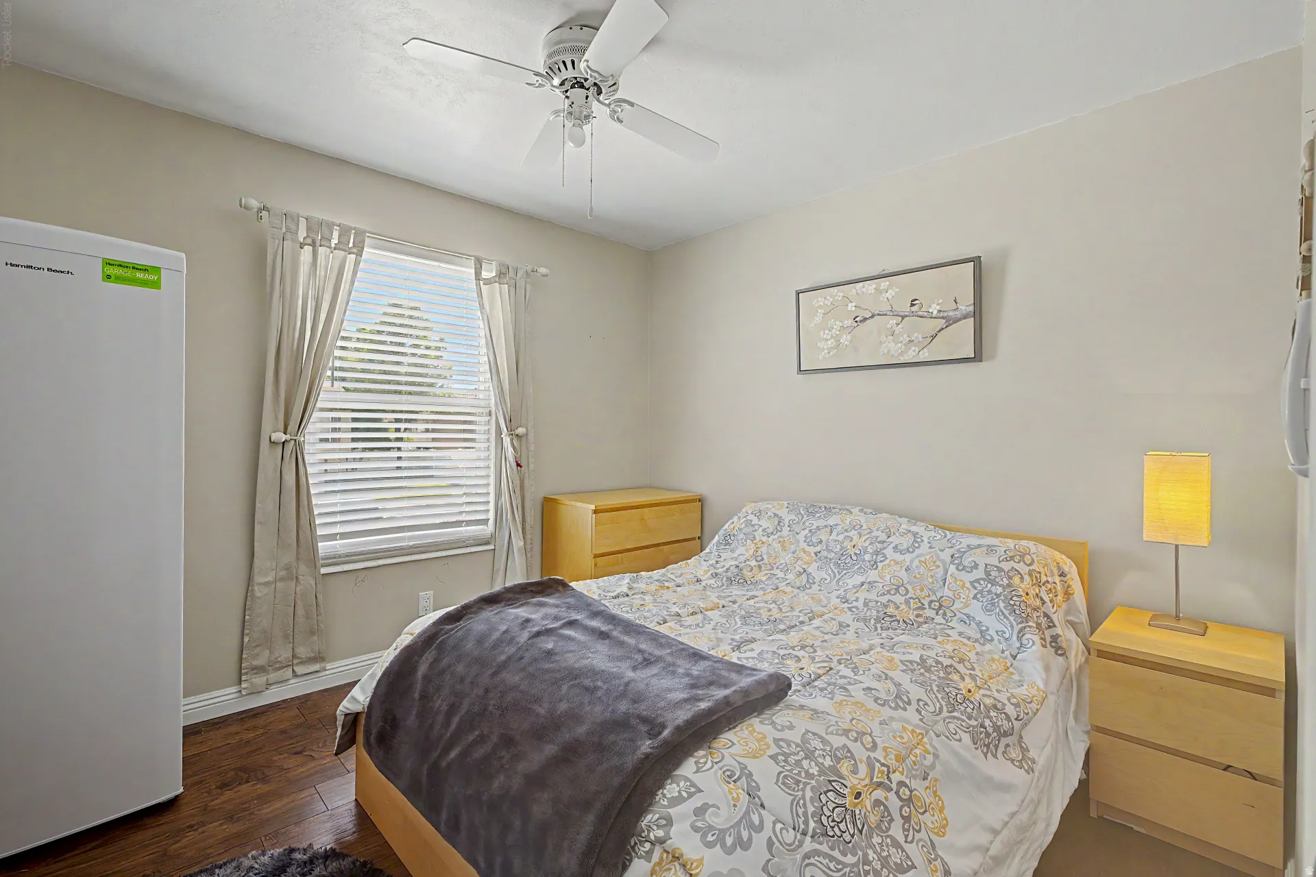 Bedroom featuring wood-finish flooring and a ceiling fan