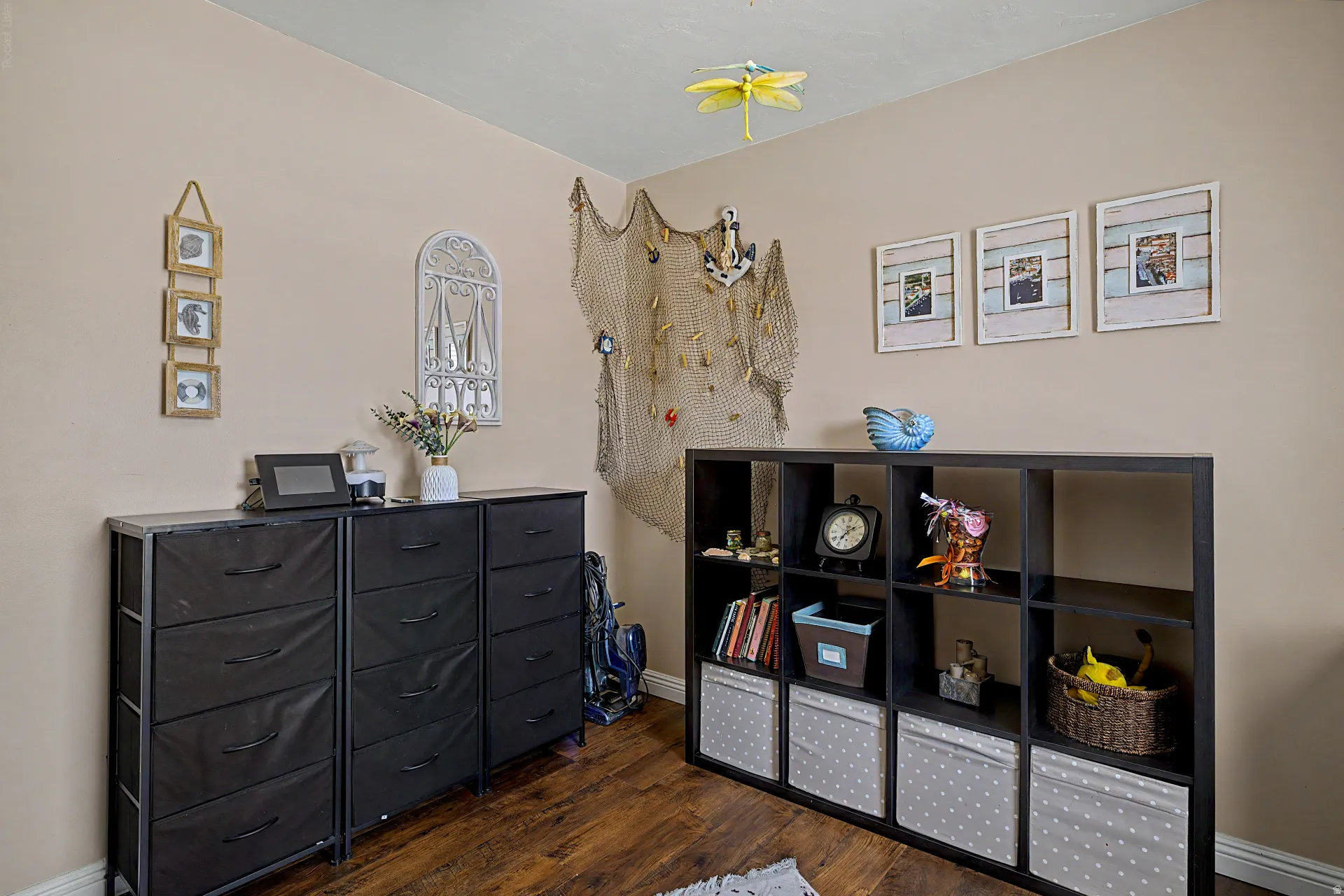 Neutral-toned wall finish with wood-finish flooring
