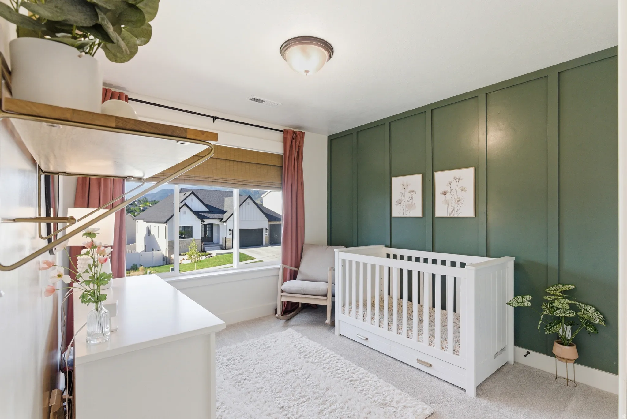 Interior space featuring a large window with roller shades, board and batten accent wall, and recessed ceiling light fixture