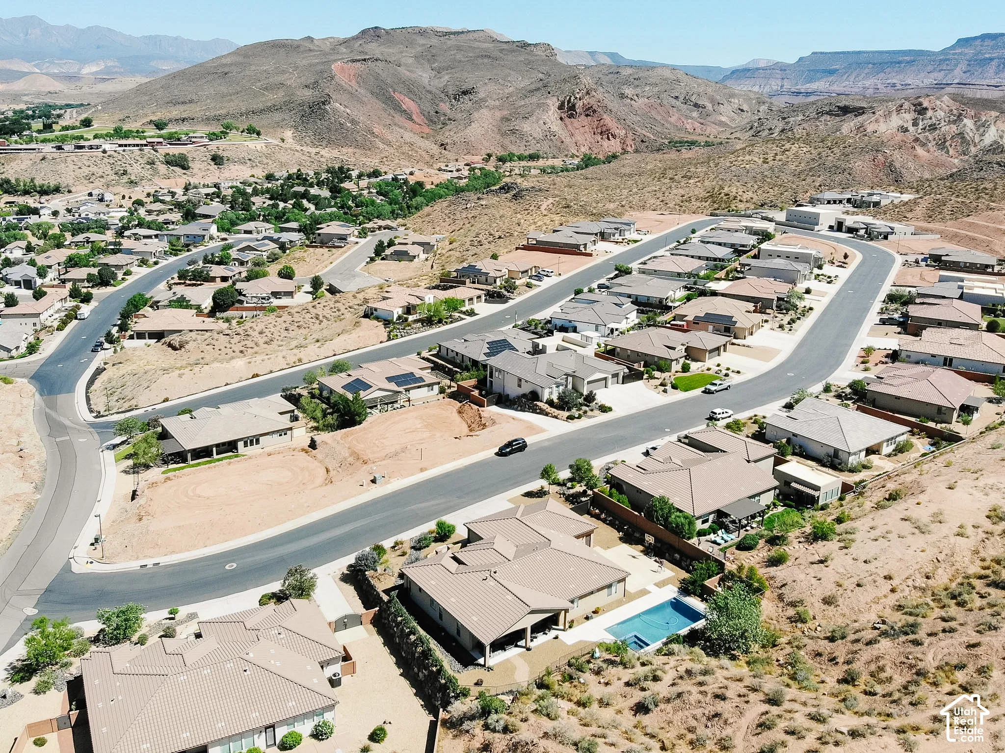 Residential neighborhood with paved streets and surrounding desert terrain