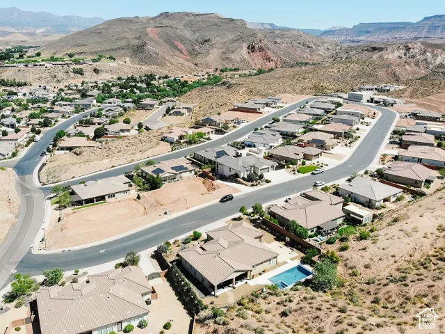 Residential neighborhood with paved streets and surrounding desert terrain