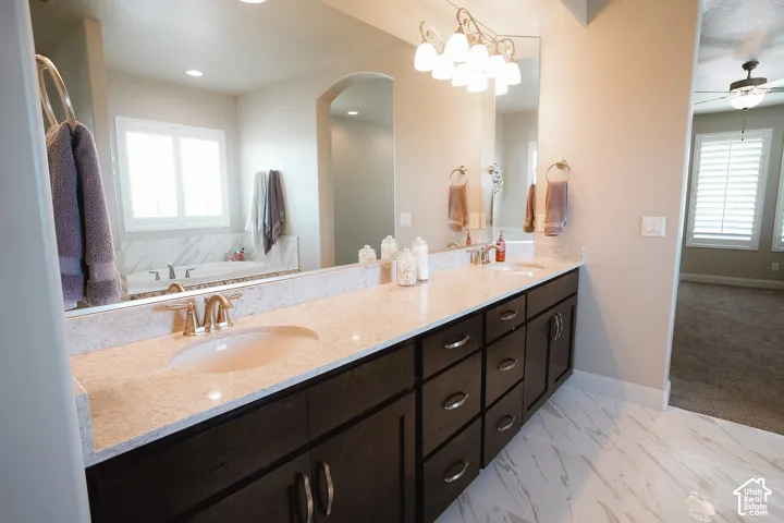 Dual vanity with undermount sinks and light-toned countertops