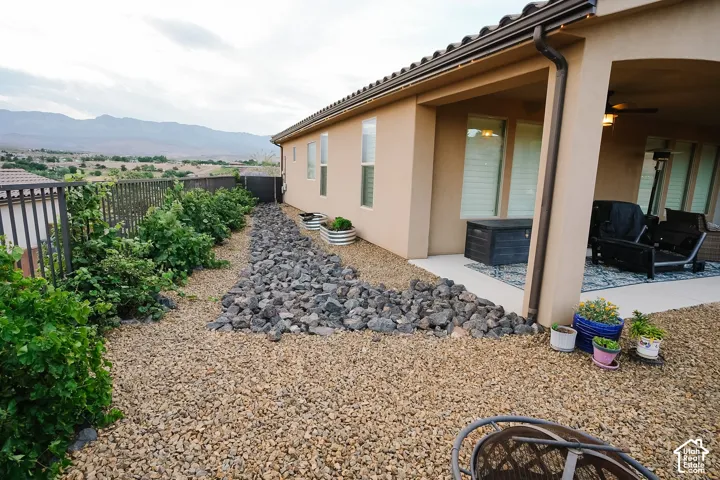 Xeriscape landscaping featuring decorative rock and mature shrubbery