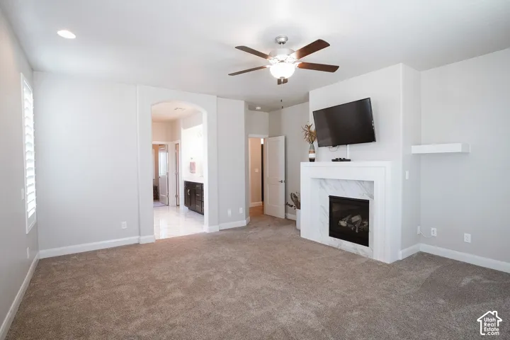 Spacious room featuring neutral carpet flooring and light wall finishes
