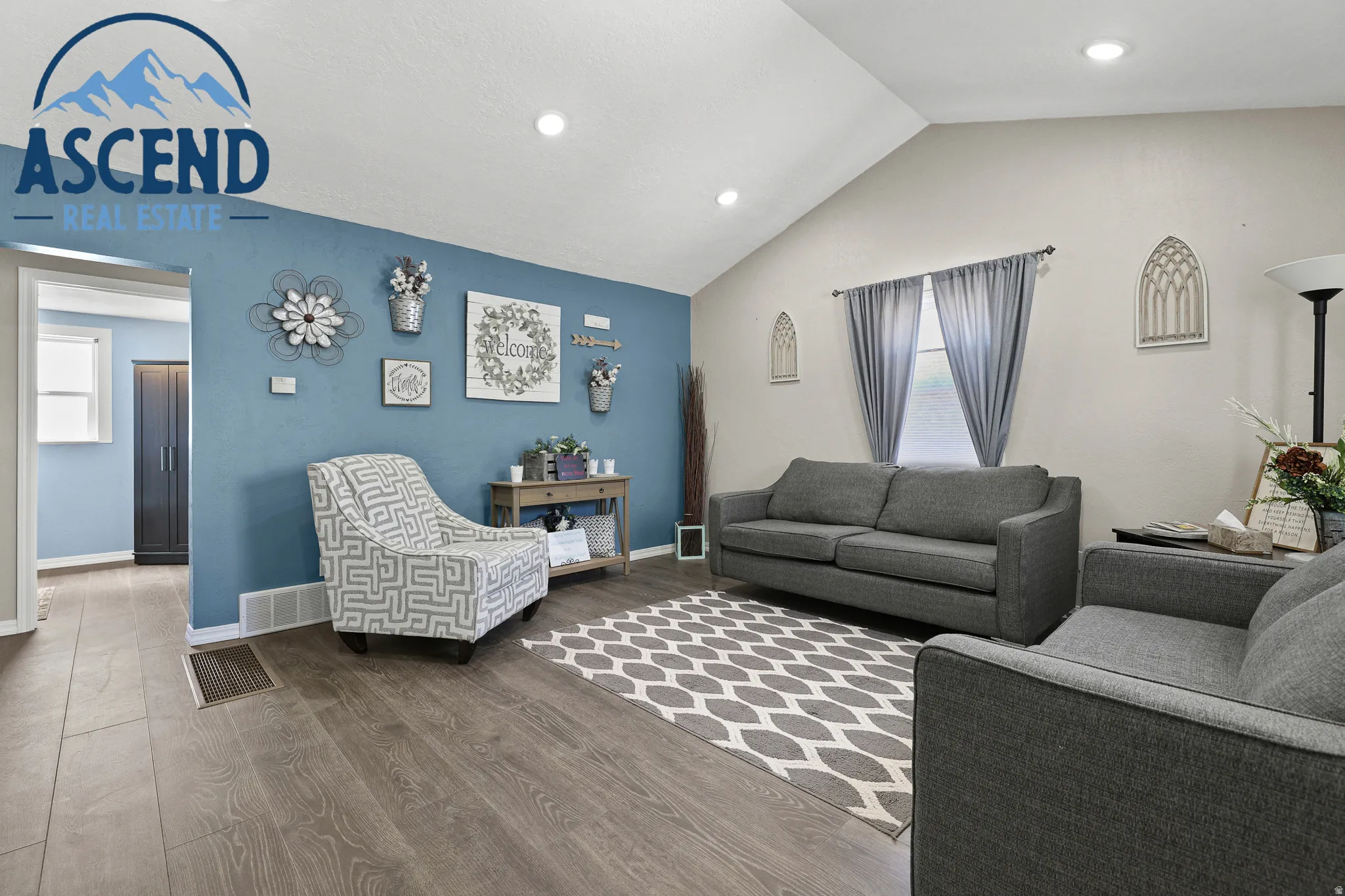 Spacious waiting/office area featuring vaulted ceilings.