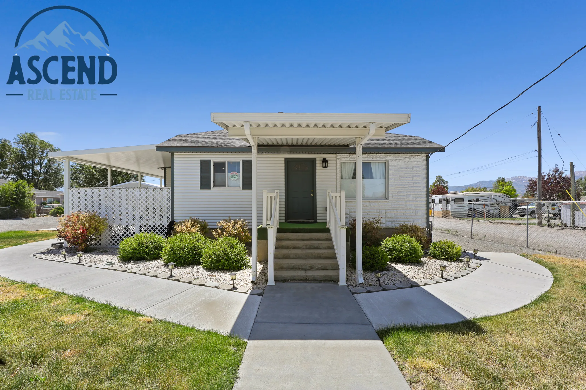Exterior featuring white siding, a covered front entry.
