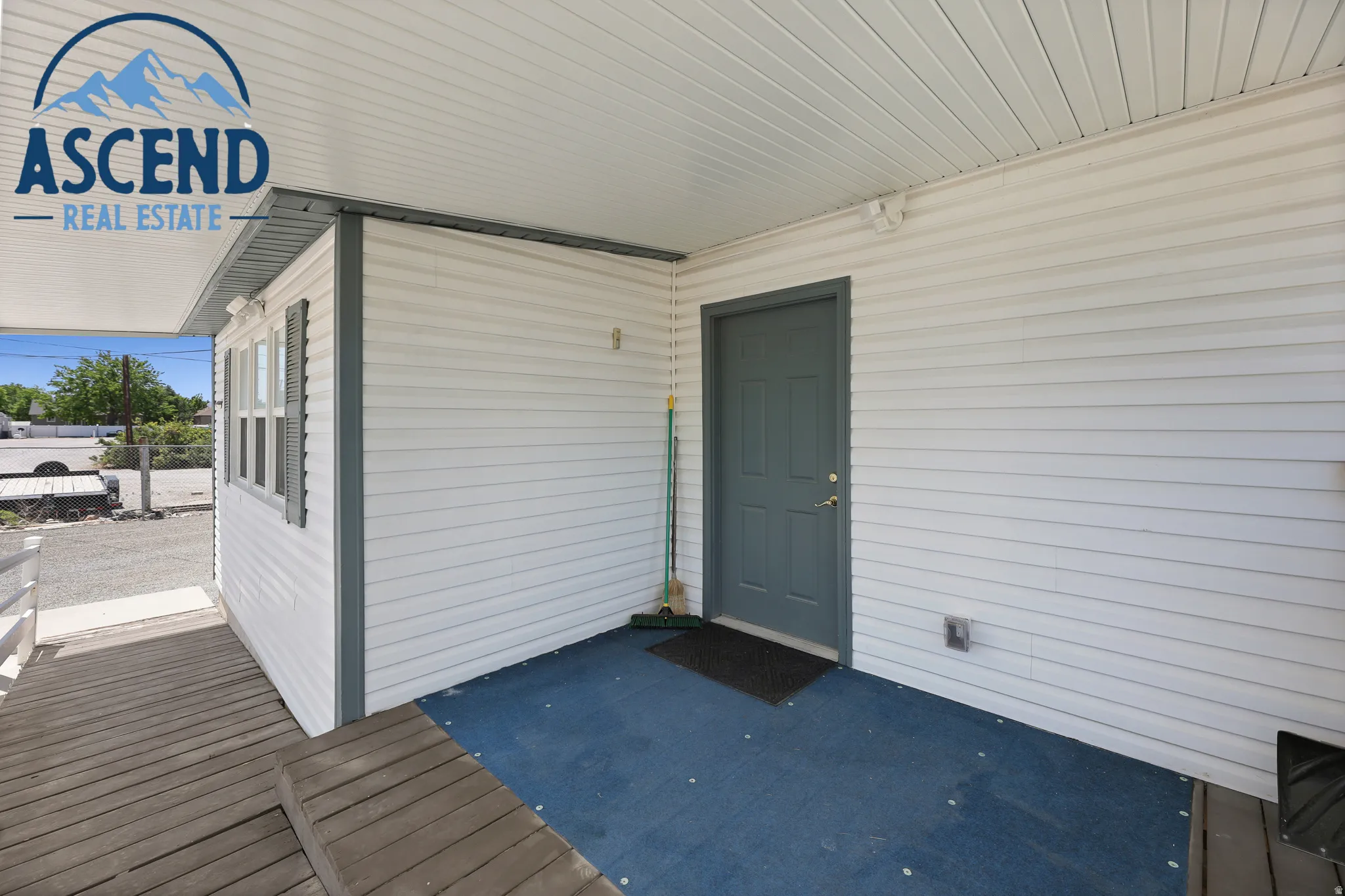 Covered porch featuring a wood-finish ramp