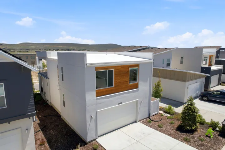 Modern architectural design featuring a flat roofline and integrated garage