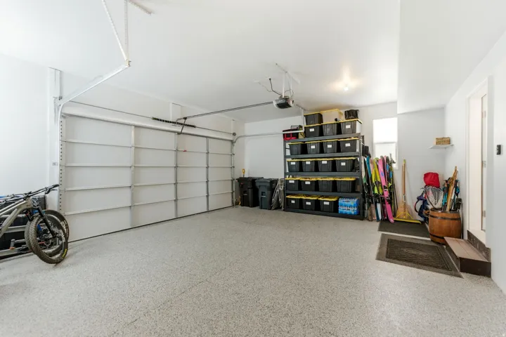 Garage with epoxy-coated flooring and a single overhead door