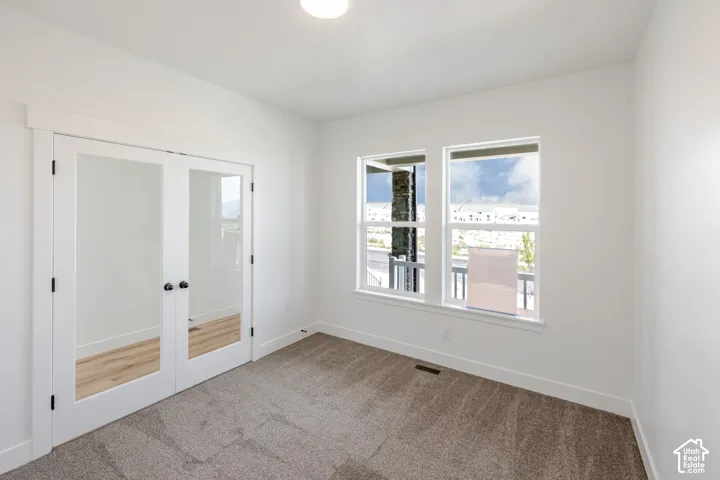 White walls with a single flush-mount ceiling light