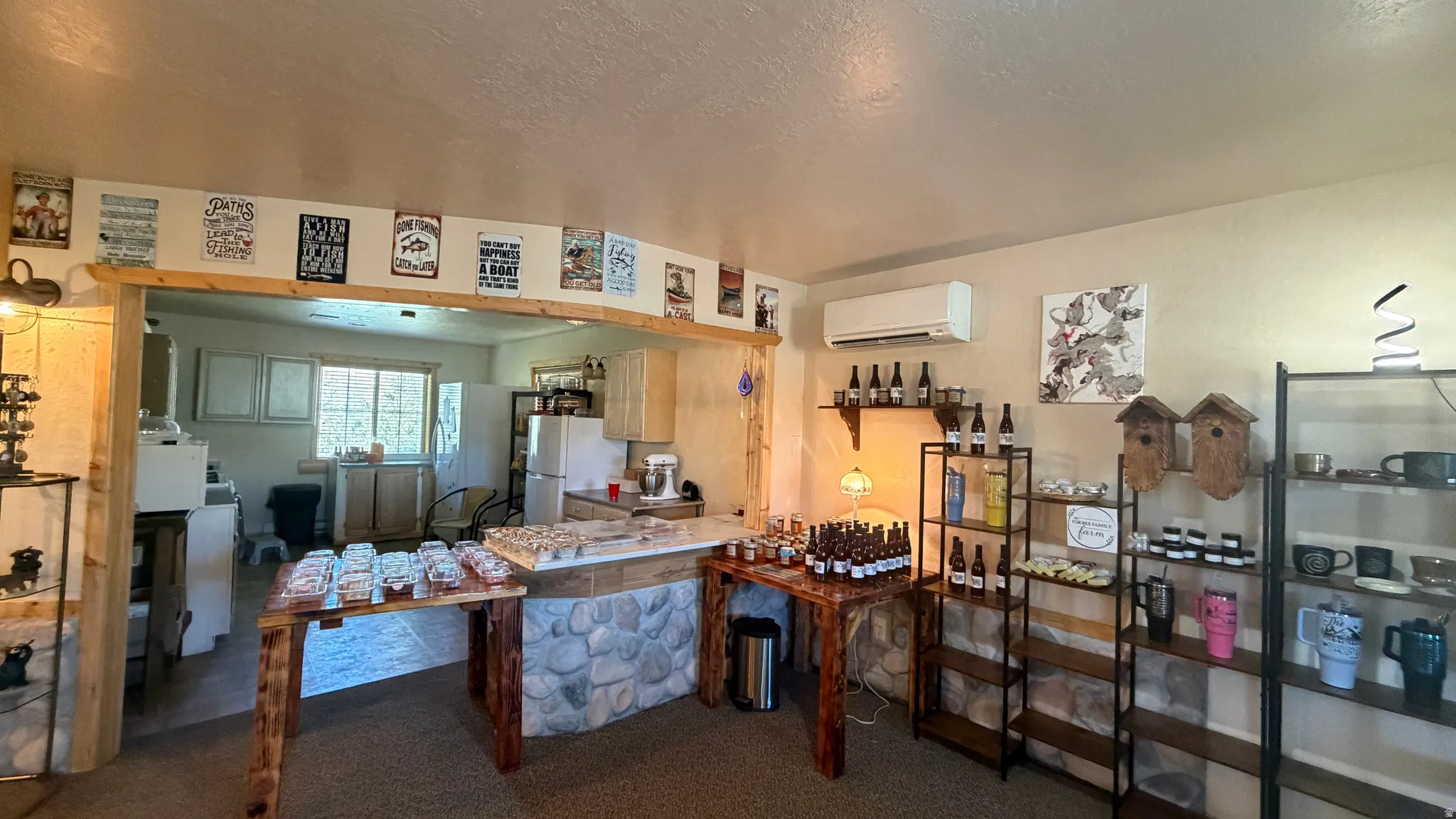 Interior space featuring a recessed archway, a stone-front counter with a wood-finish top, and a split air conditioning unit