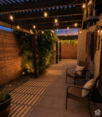 Covered patio at dusk with lighting included