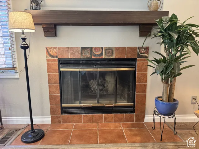 Fireplace with custom wood mantel & tile surround (chimney capped)