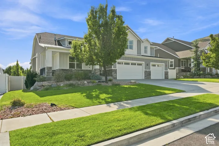 Wrap around porch, 3 car Garage