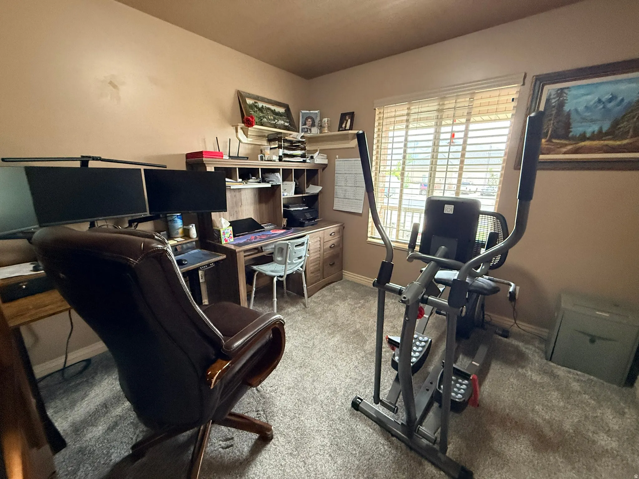 Dedicated room featuring neutral wall paint and textured carpet flooring