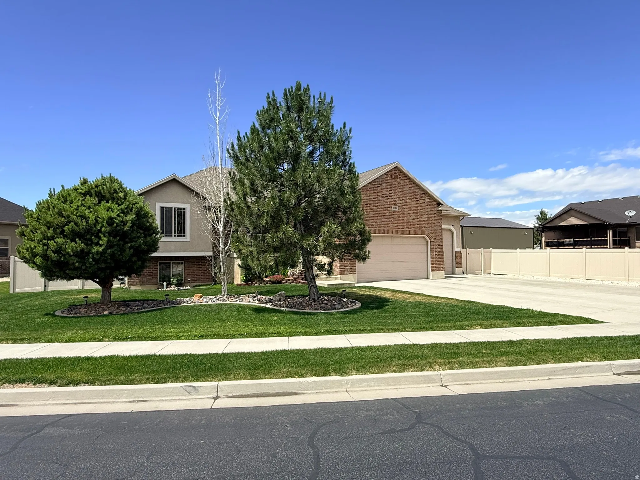 Property exterior featuring a combination of brick and stucco siding