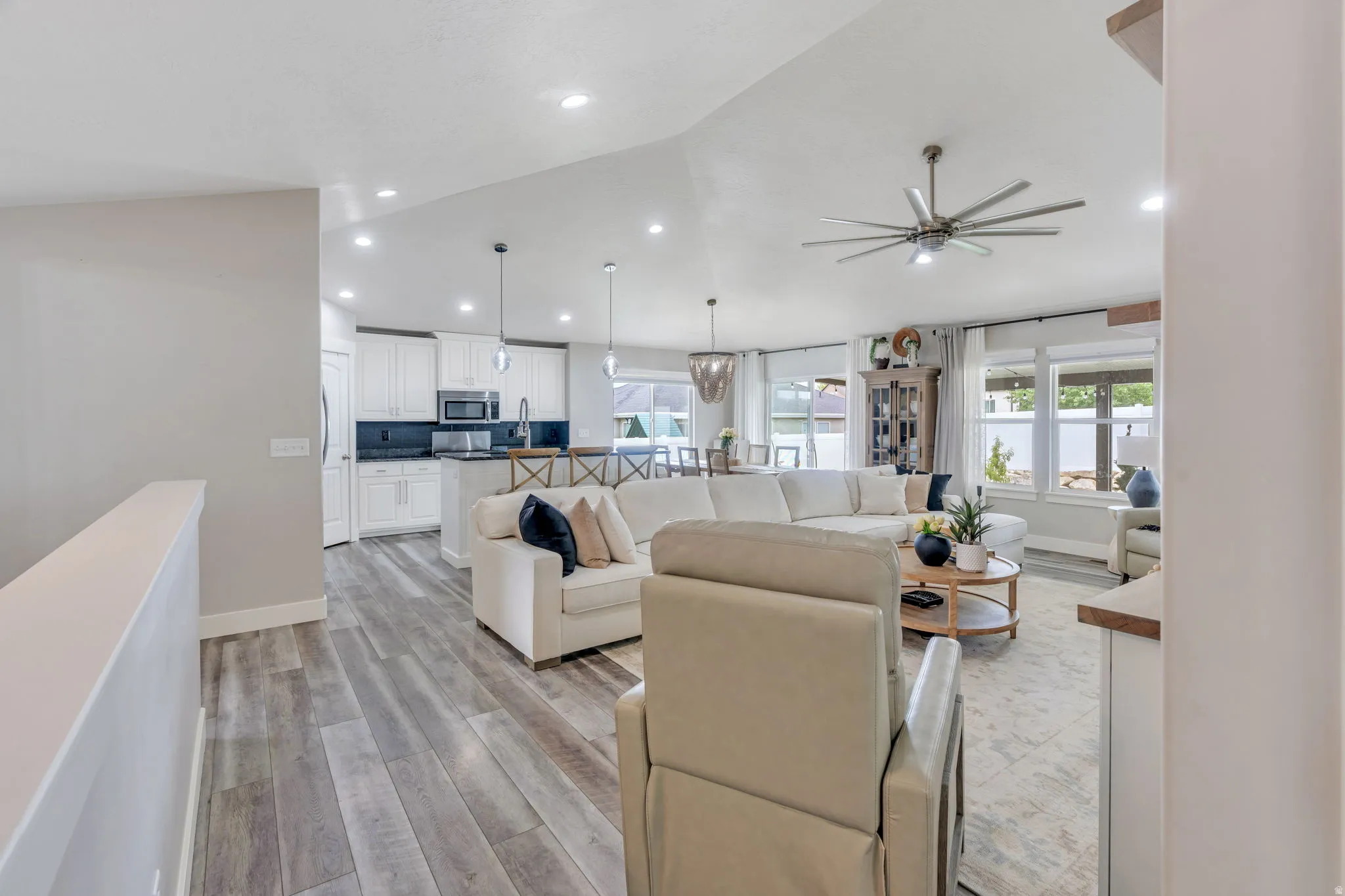 Open concept living area with wood-finish flooring