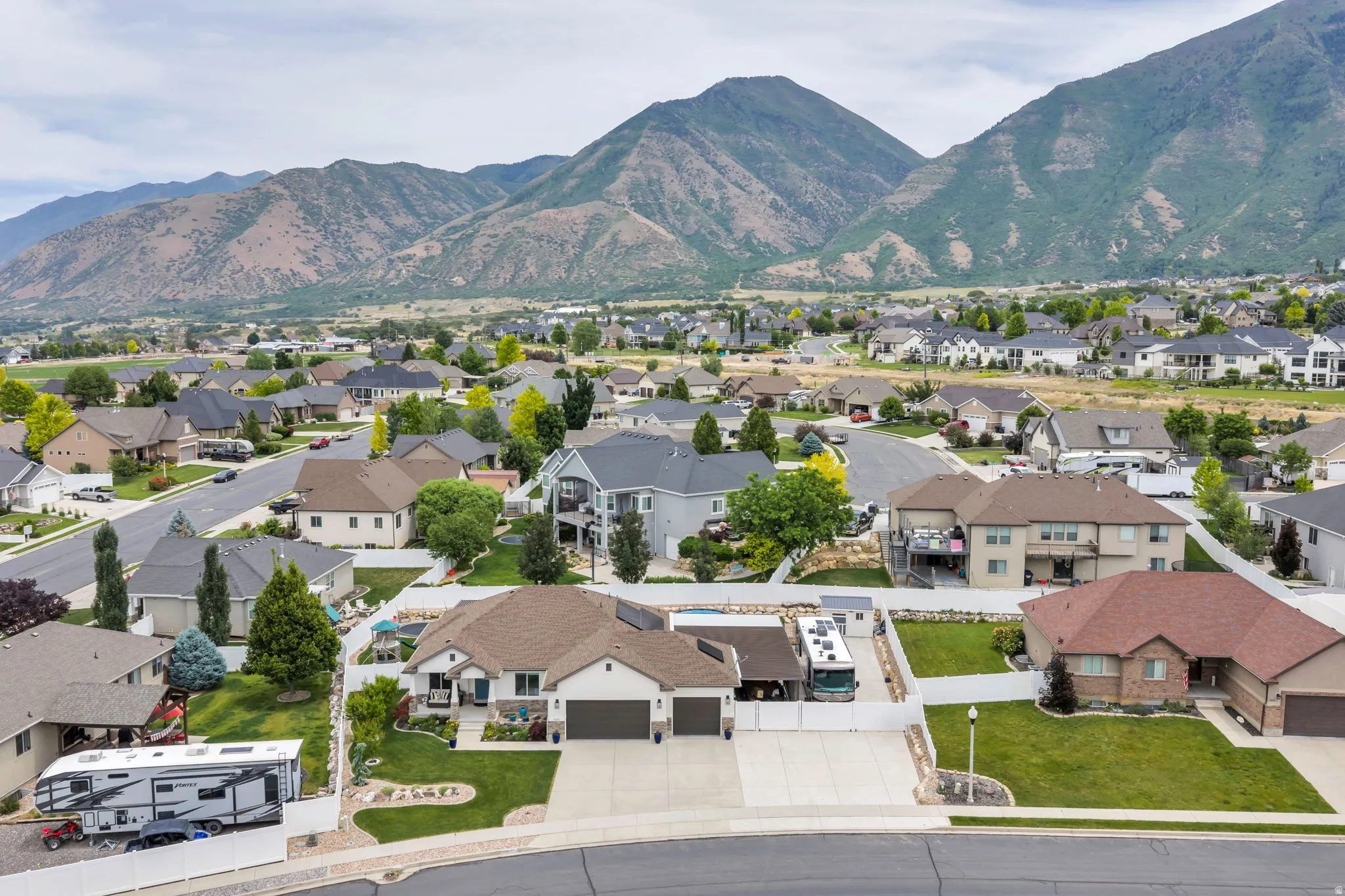 Residential neighborhood featuring single-family homes with mountain backdrops
