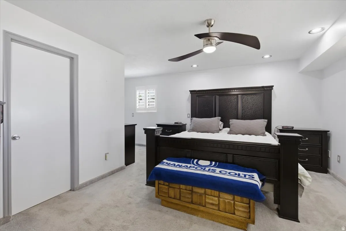 Spacious room featuring neutral carpeting and white walls