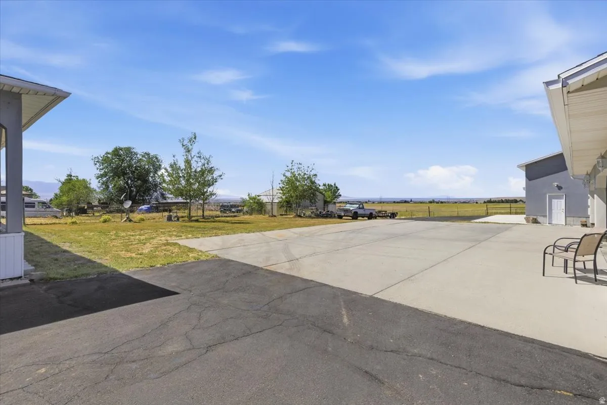 Expansive concrete and asphalt paving areas provide substantial hardscaping