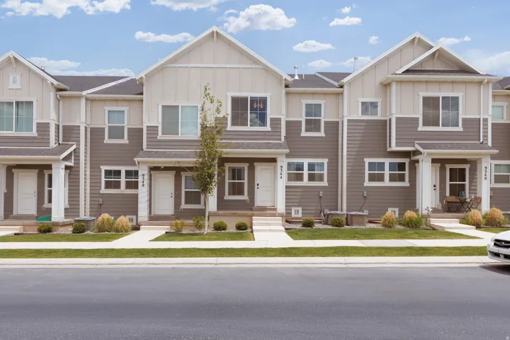 Contemporary townhome exterior featuring a neutral color palette