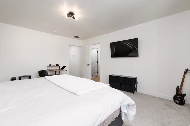 Neutral white walls and light gray carpeting