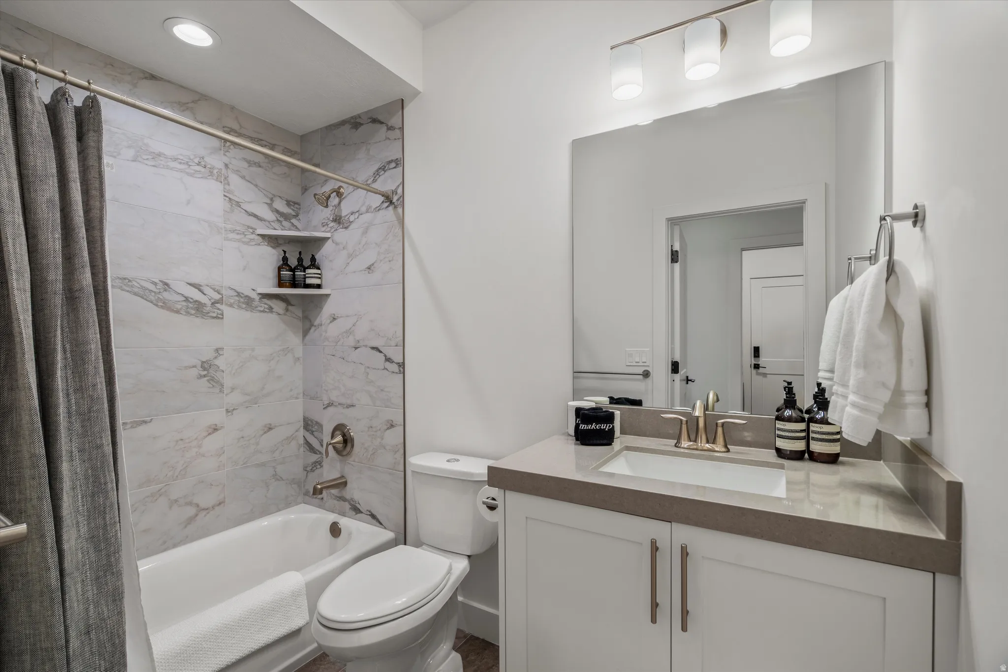 Full bath with tub and shower.
