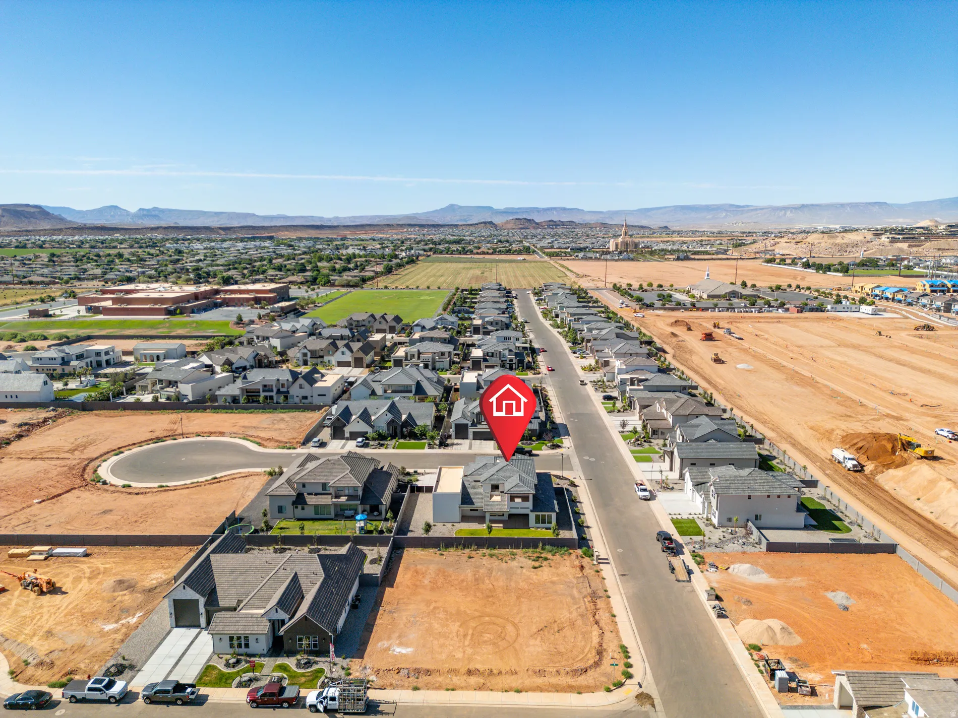 Aerial perspective showcasing the residential area with distant mountains