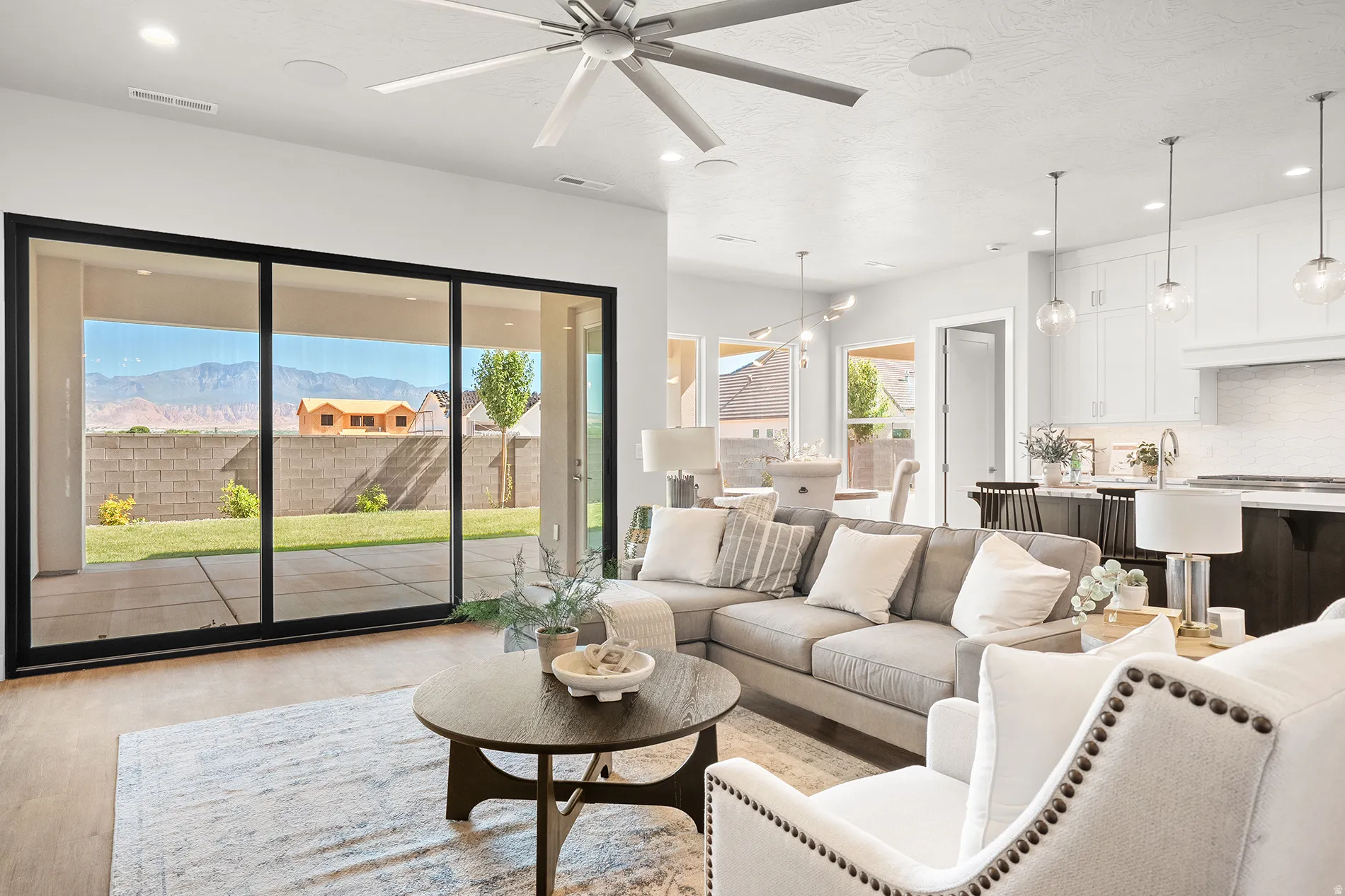 Open concept living area with wood-finish flooring