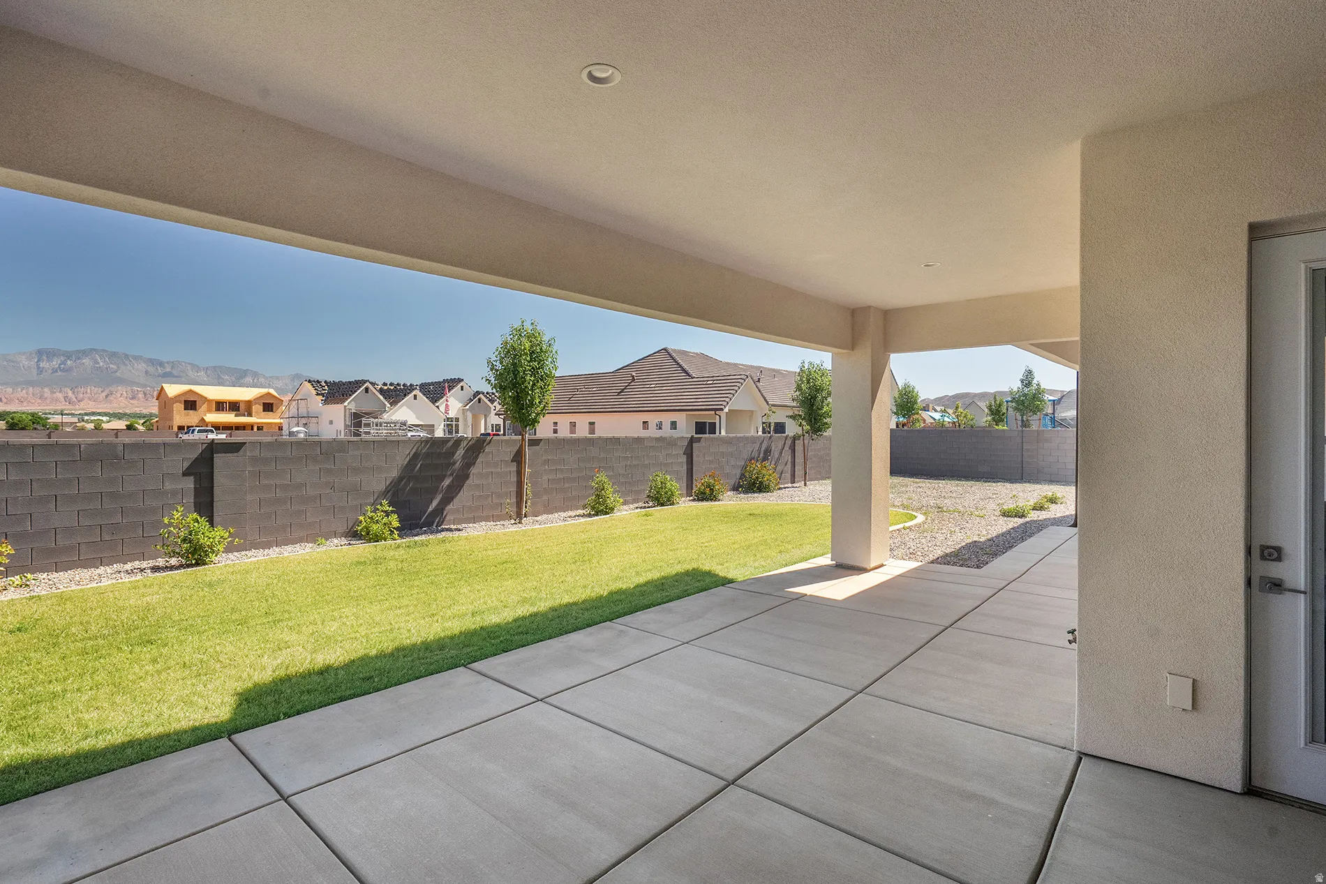 Covered patio with recessed lighting and concrete flooring