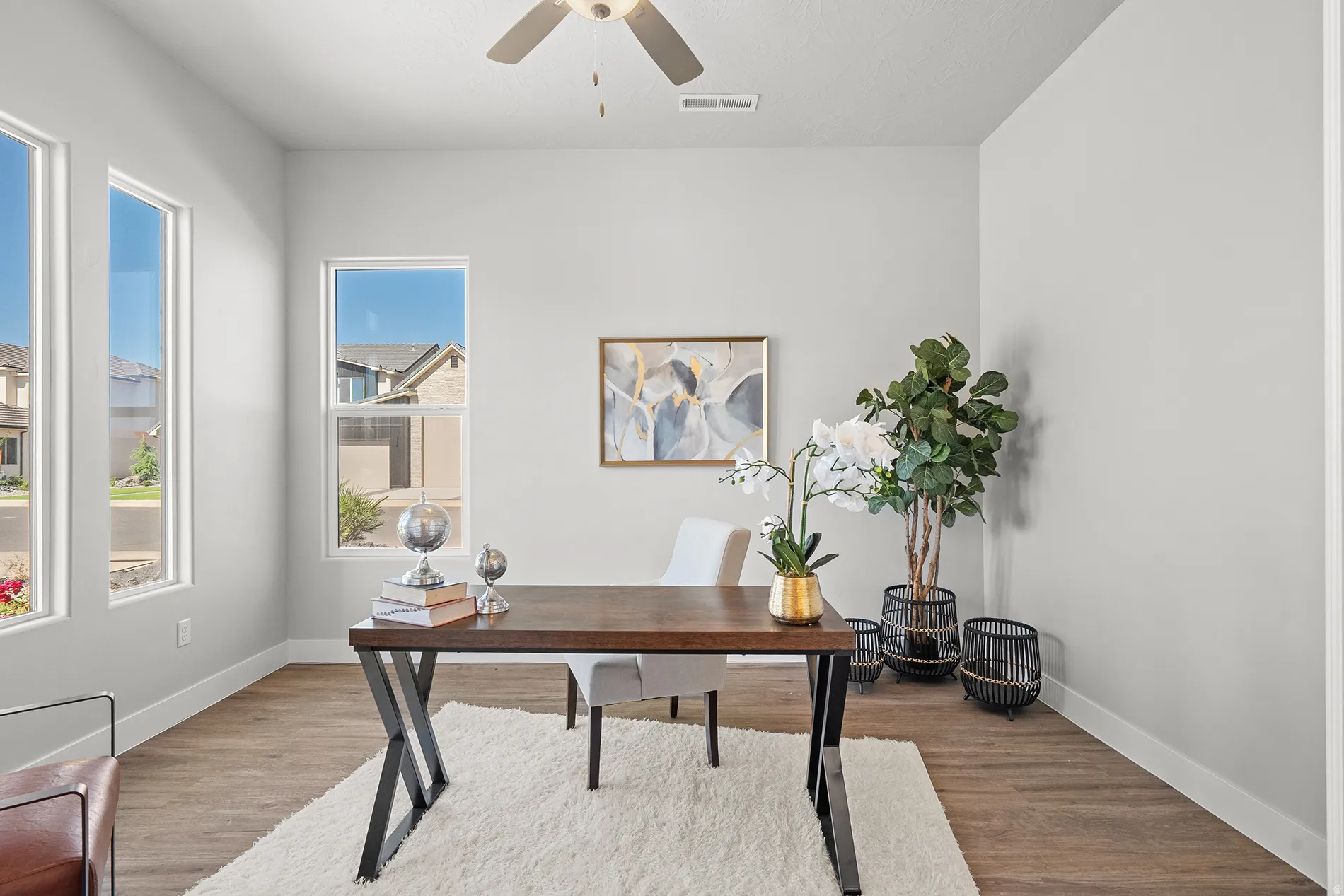 Bright interior space featuring light-toned walls and wood-finish flooring