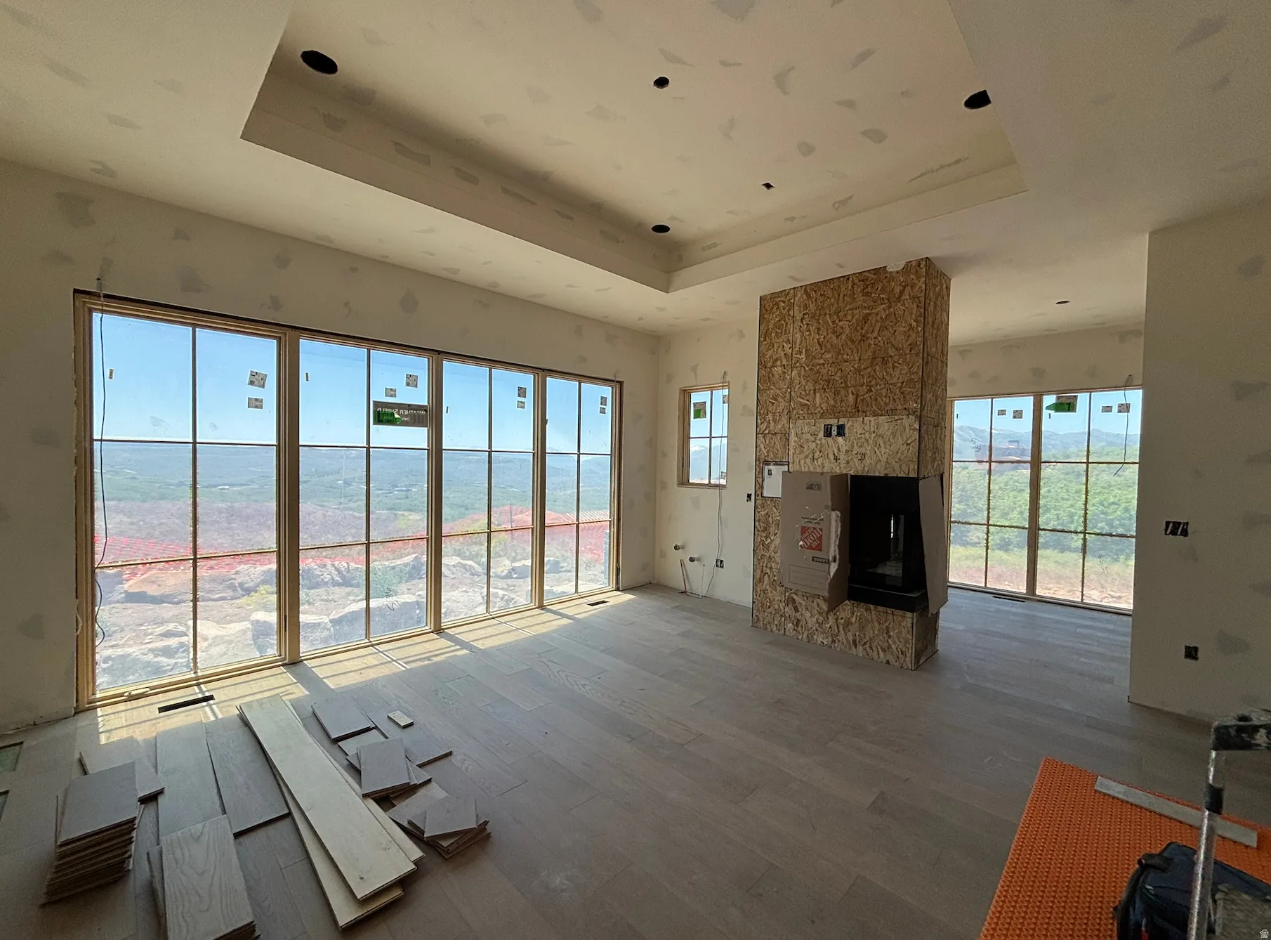 Owner's suite featuring a peninsula fireplace