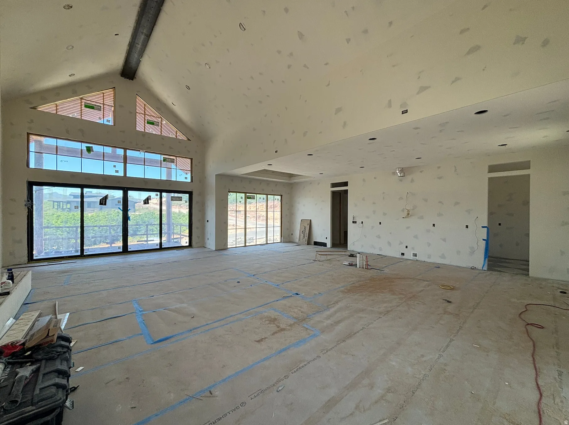Spacious living space featuring vaulted ceilings