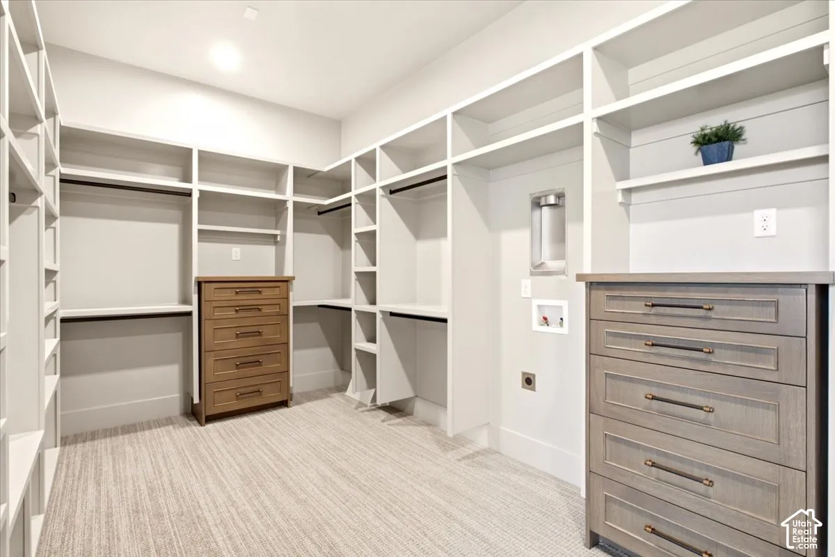 Owner's closet featuring a place for a washer/dryer