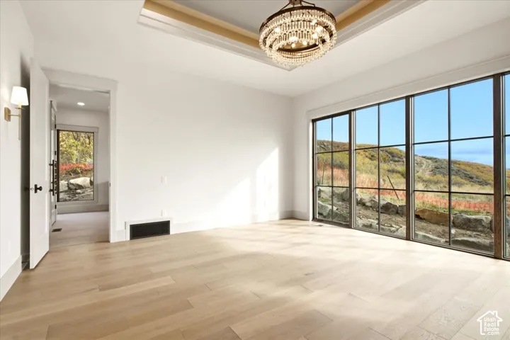 Owner's suite featuring floor to ceiling windows showcasing the views